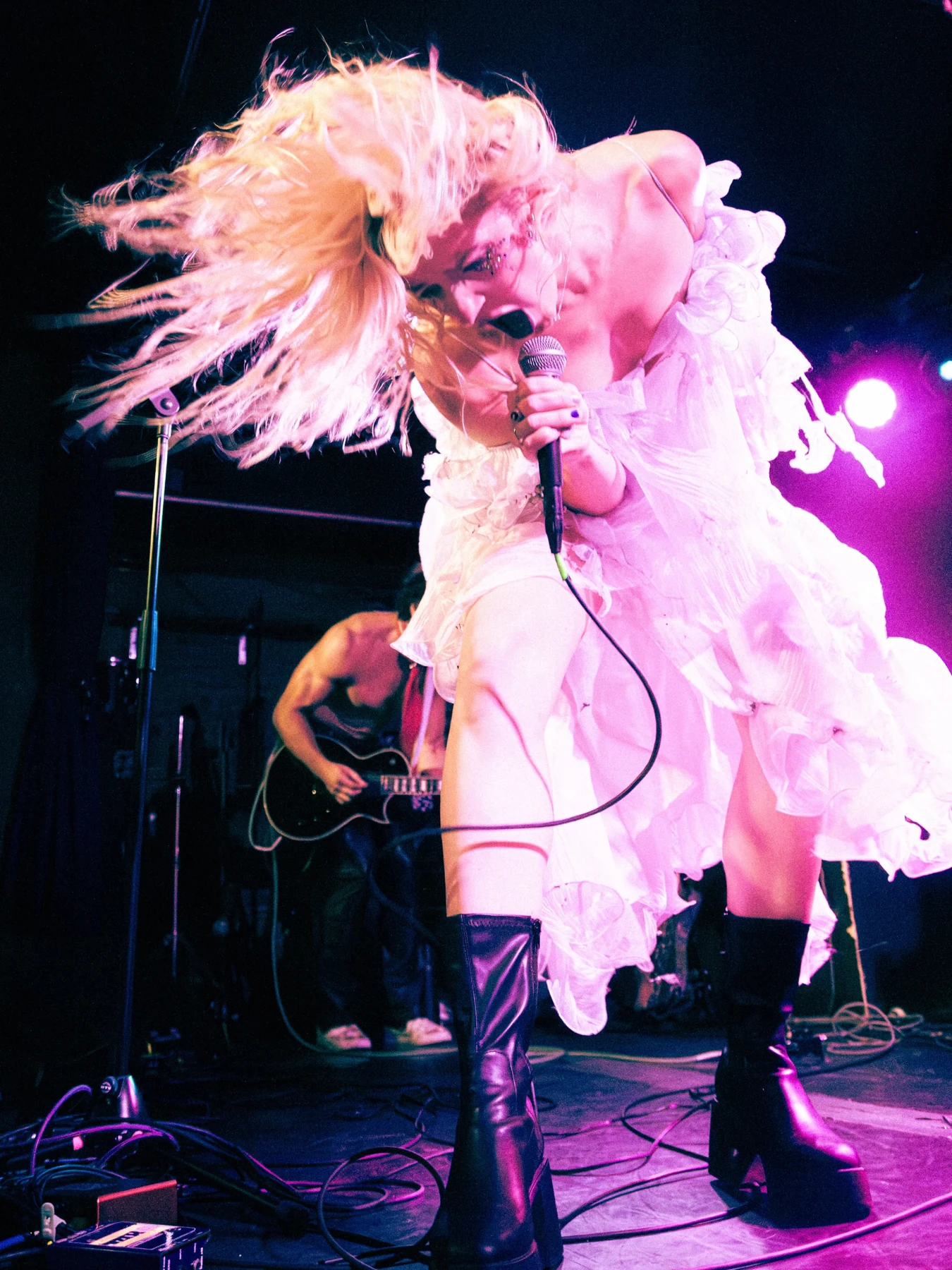 Sunday singing in a pink feathered stage outfit